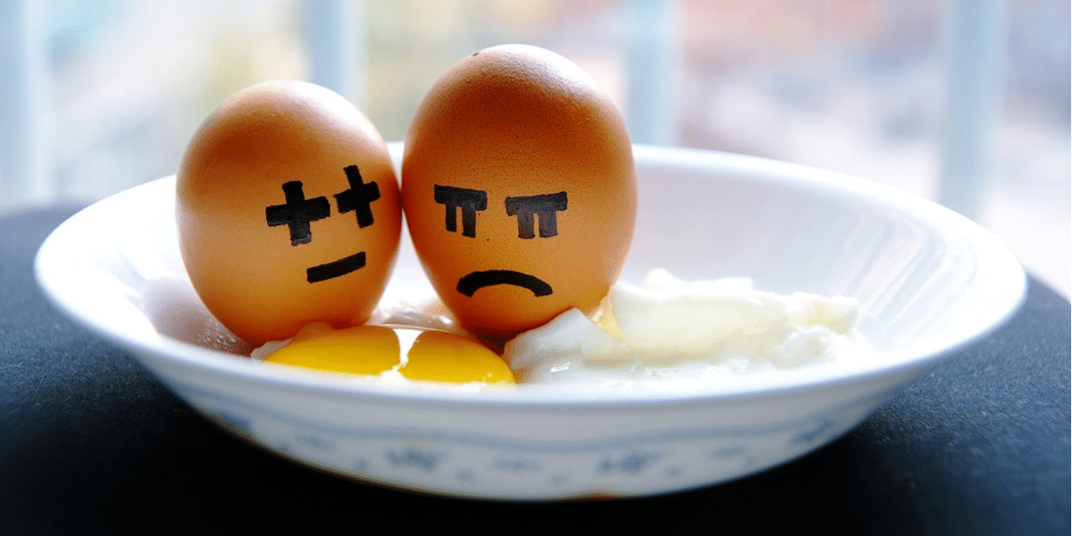 Photo of eggs with unhappy faces painted on them